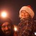 Three year old Harper smiles after seeing a glimpse of Santa Claus  across the street.
Courtney Sacco I AnnArbor.com  